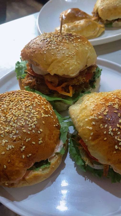 Mini burgers with fresh lettuce and sesame buns