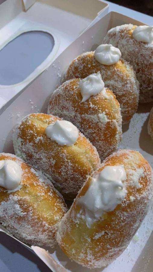 Glazed doughnuts with cream and cinnamon